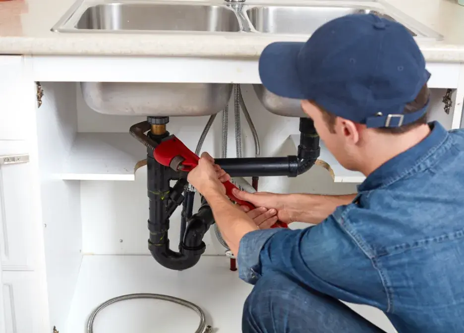 Plumber working after obtaining a C36 Plumbing Contractors License In California
